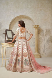 Cream & Peach Silk Wedding Lehenga with Leaf Embroidery & Peacock Motifs
