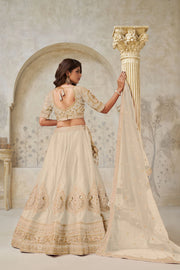 Beige Silk Wedding Lehenga with Leaf Embroidery & Peacock Motifs