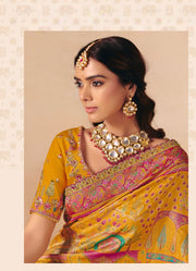 Royal mustard yellow Dola Zari Silk Saree with Heavy Embroidery & Cutwork Lace