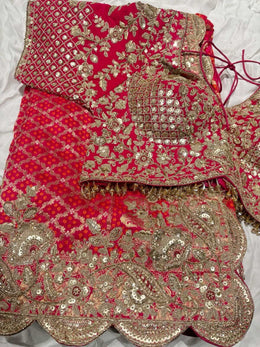 Rani Pink Bandhani Designer Saree with Heavy Zari Embroidered Blouse