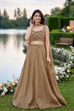 Golden Intricate handwork blouse paired with a free-flowing, easy-to-carry lehenga