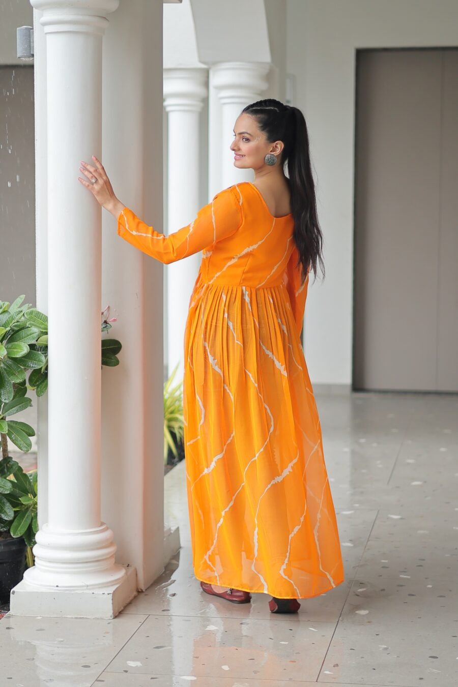 Yellow Print Work Kurti with kutchi Patchework in Faux Georgette.